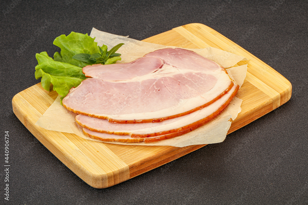 Sliced pork belly over board