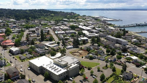 Cinematic 4K drone dolly shot of the downtown Edmonds commercial area, Kingston ferry terminal waterfront marina, Puget Sound near Seattle in Western Washington, Pacific Northwest, in Snohomish County photo