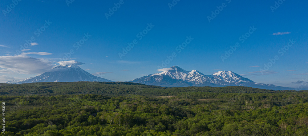 Panorama volcano landscape of Kamchatka Peninsula. Domestic Volcanoes. Avachinskiy, Koryaksky, Kozelsky volcanoes