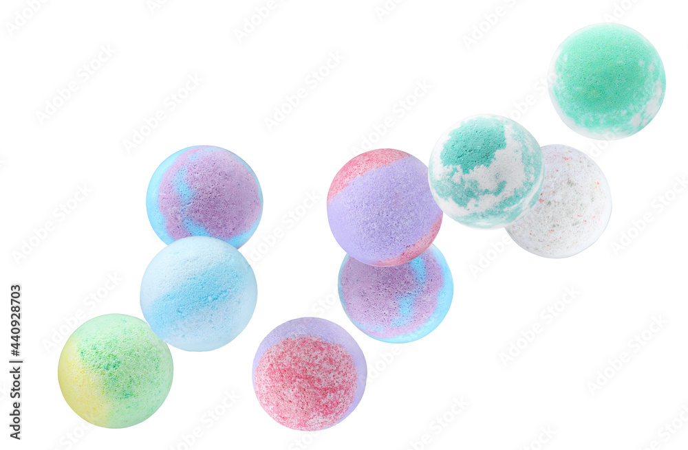 Many different aromatic bath bombs falling on white background Many different aromatic bath bombs falling on white background