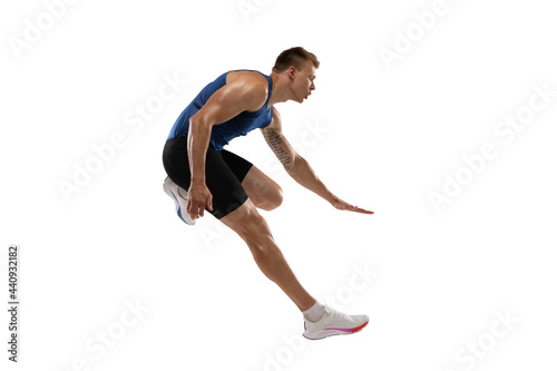 Athlete man athlete jumps over the barrier isolated on white background. © master1305