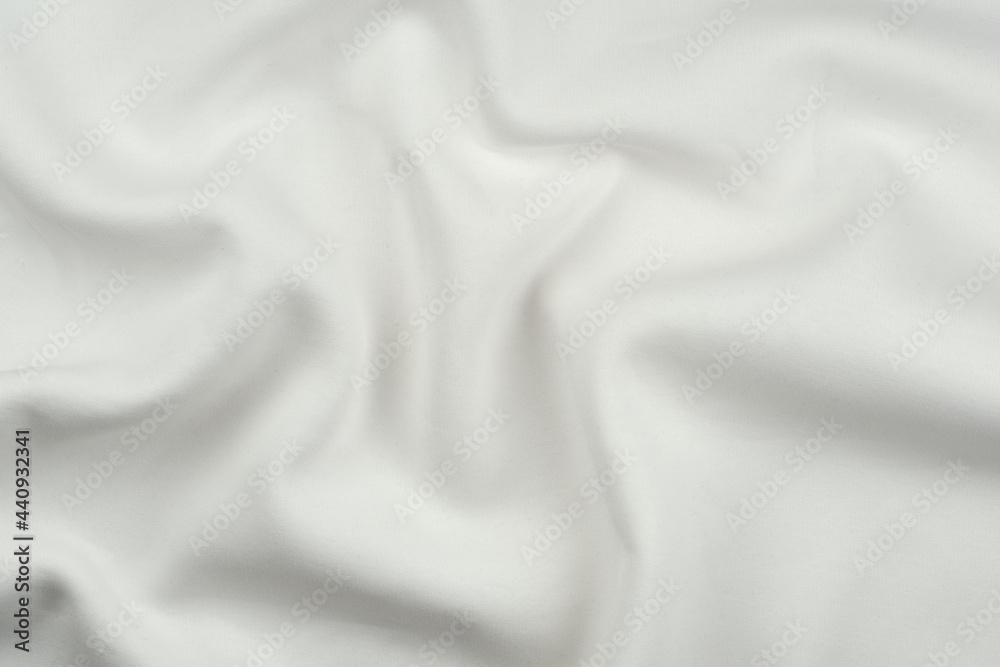 Background from white monochrome cotton fabric. Close up texture of the fabric is useful as a background. Background from white monochrome cotton fabric. Close up texture of the fabric is useful as a background.