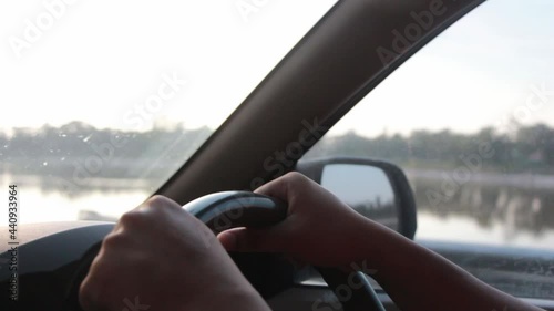 Wallpaper Mural Close-up of Man driving car, at holiday. Guy enjoying travel journey at evening time. Torontodigital.ca