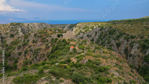 Aerial drone photo of ruins of Byzantine Medieval ancient city of Palaiochora - old Kythira island capital built in start of Canyon leading to Kaki Lagada beach, Ionian, Greece