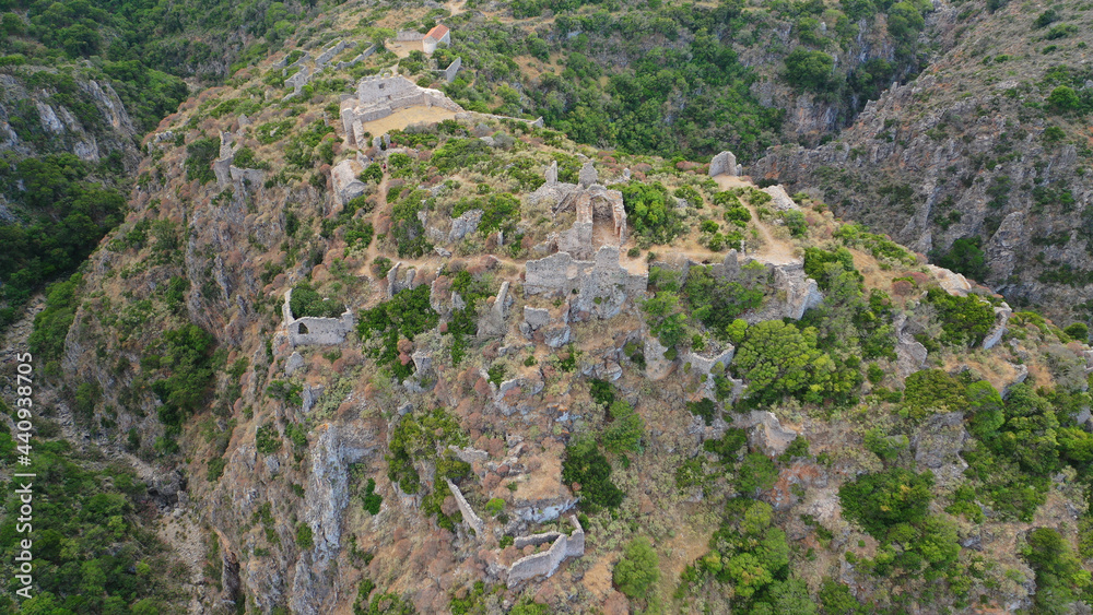 Fototapeta premium Aerial drone photo of ruins of Byzantine Medieval ancient city of Palaiochora - old Kythira island capital built in start of Canyon leading to Kaki Lagada beach, Ionian, Greece