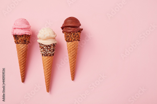 Strawberry, vanilla and chocolate ice cream cones