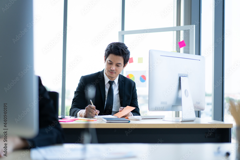 Small group of businesspeople working in their office with social distancing. Small group of businesspeople working in their office with social distancing.