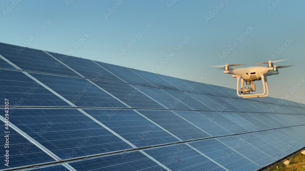 The drone monitors solar panels. The concept of the near future