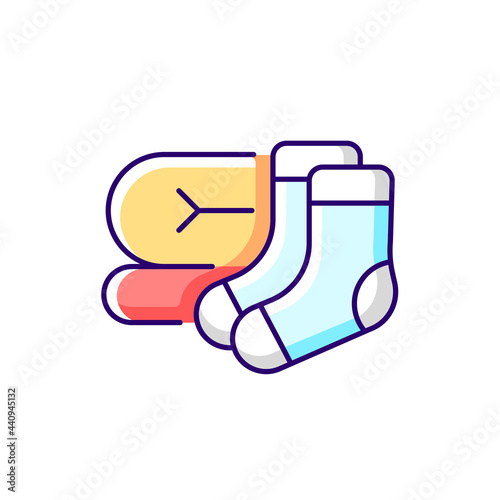 Socks and blanket RGB color icon. Portable amenities for camping comfort. Essential things for tourist. Isolated vector illustration. Travel size objects simple filled line drawing