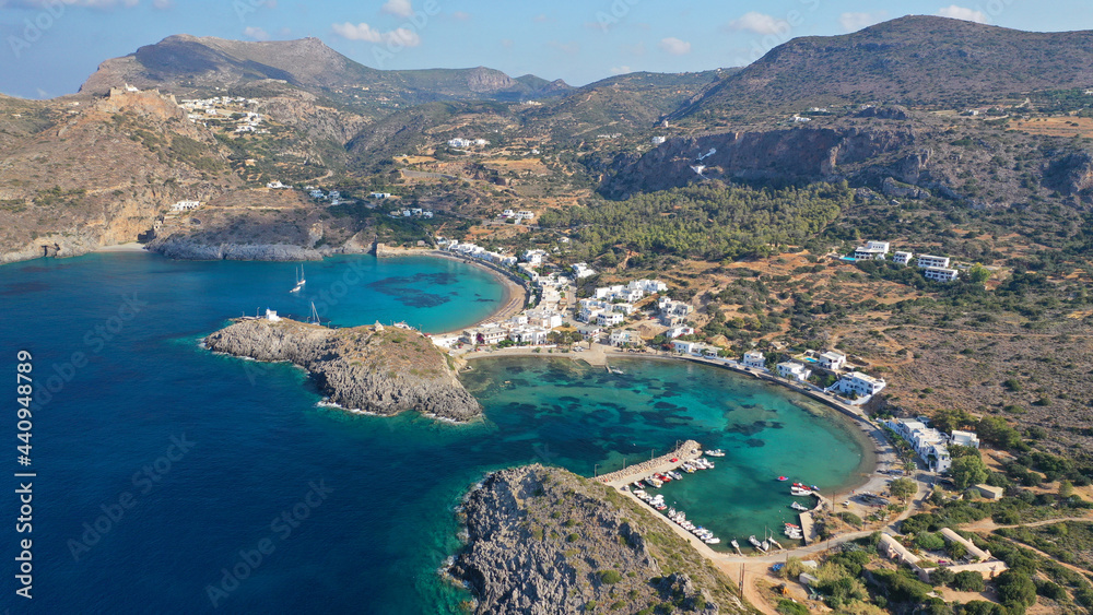 Aerial drone photo of beautiful twin bay, beach and small village of Kapsali  below iconic castle of Kythera island, Ionian, Greece