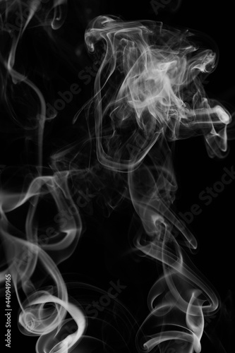 Fototapeta Naklejka Na Ścianę i Meble -  White smoke swirls on black background