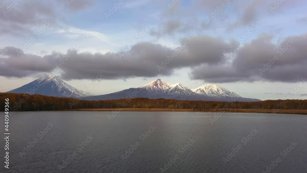 custom made wallpaper toronto digital4k drone footage. Aerial view of camera going backward under a lakes. Beautiful evening volcano landscape of Kamchatka Peninsula at sunset: scenery autumn view of cone of volcanoes Avachinskaya