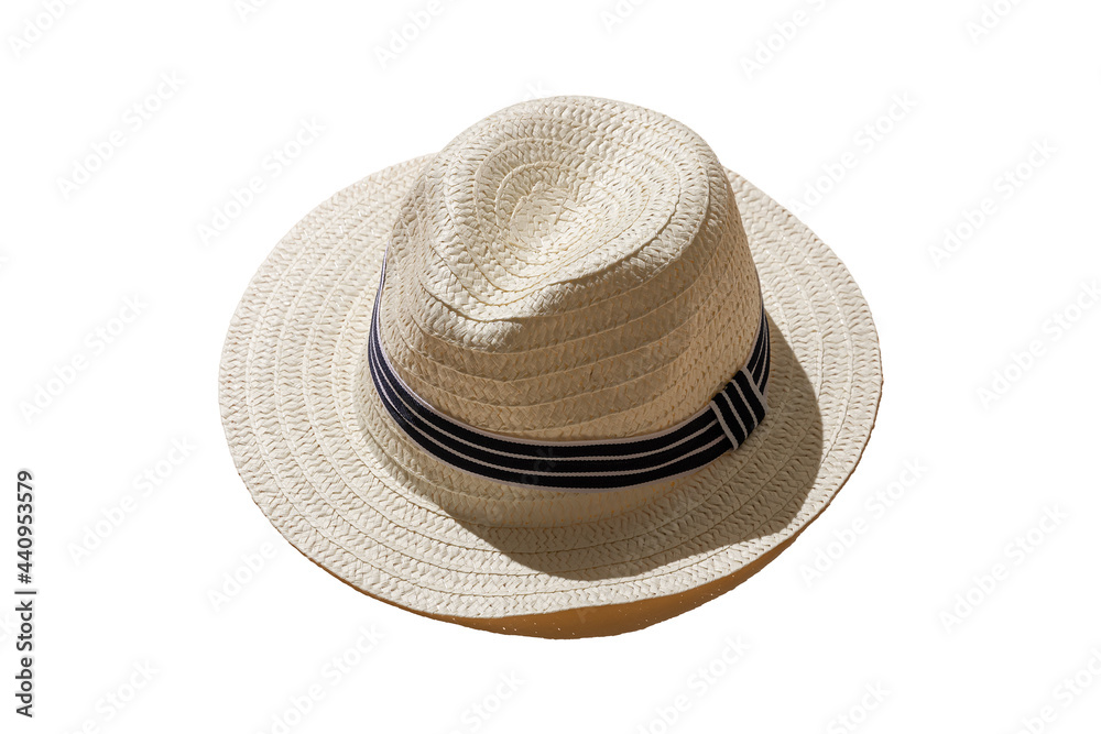 straw wicker hat isolated on a white background. hard shadows of the sun. minimal concept of travel and vacation