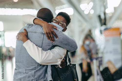 Couple giving good bye hug at airport