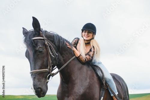 Beautiful girl riding a horse in countryside.