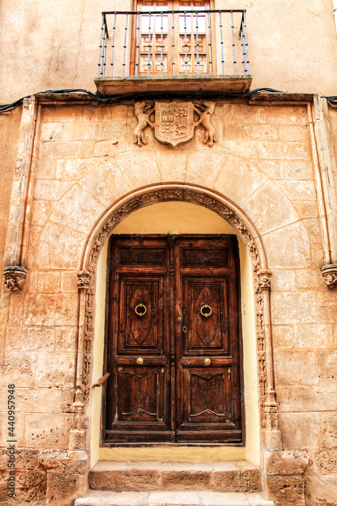 Old facade and entrance of majestic house in Alcaraz, Albacete province, Spain