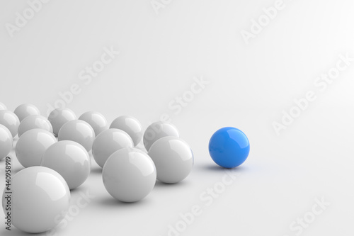 Leadership concept, blue leader ball, standing out from the crowd of white balls. 3D Rendering