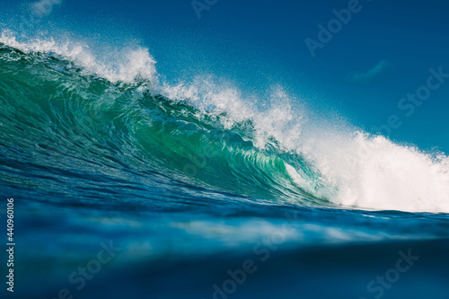 Turquoise wave in sea. Breaking wave in sunny day
