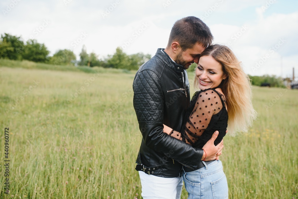 happy couple in love at sunset and smiling happy couple in love at sunset and smiling
