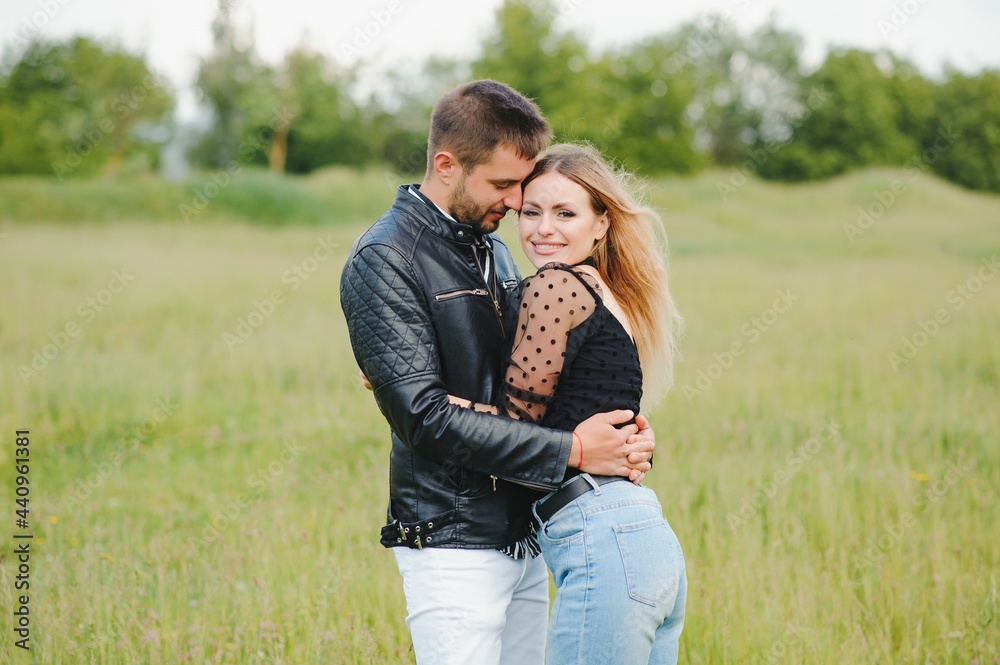 happy couple in love at sunset and smiling happy couple in love at sunset and smiling