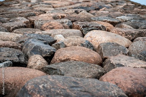 Paving cobblestones. Large stones are stacked next to each other. Backgrounds and surfaces (893)