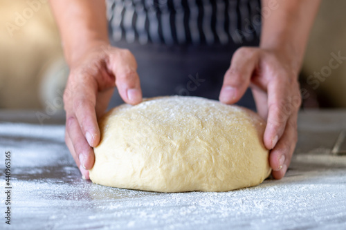 Dough makes fresh bread on the kitchen table.