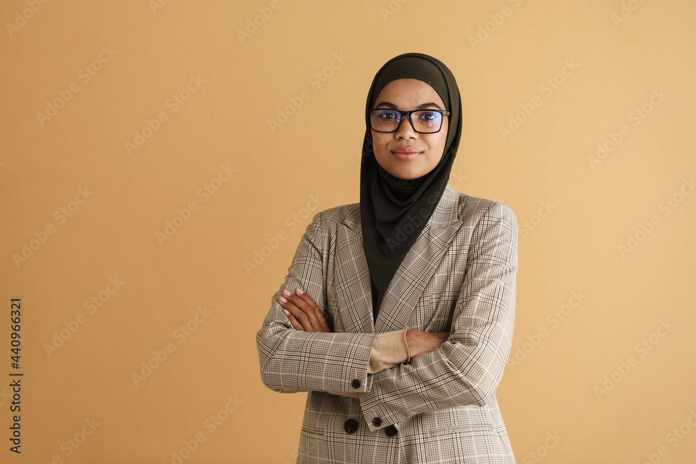 Black muslim woman in hijab smiling while posing at camera Stock Photo ...