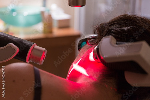 Woman in laser physiotherapy treatment