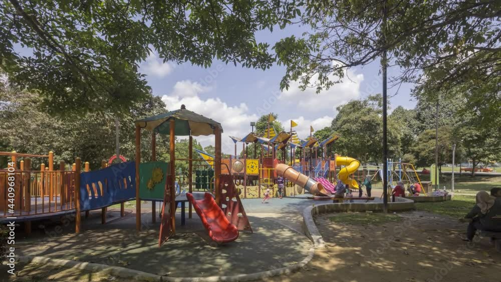 timelapse of colorful playground on yard in the park