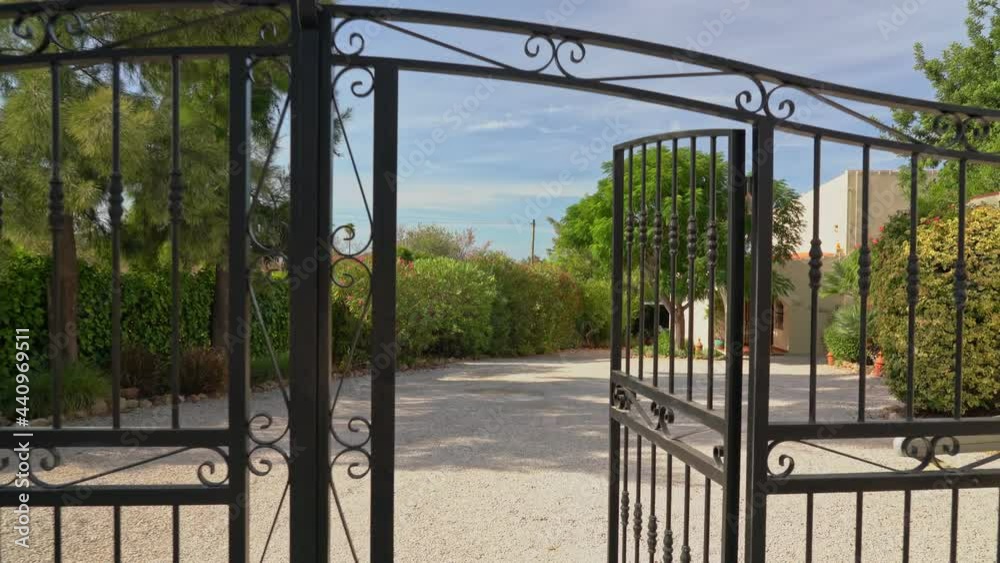 Passage through the gate ahead with a video camera through the wicket of a private house. Closed private property. Passage through the gate ahead with a video camera through the wicket of a private house. Closed private property.