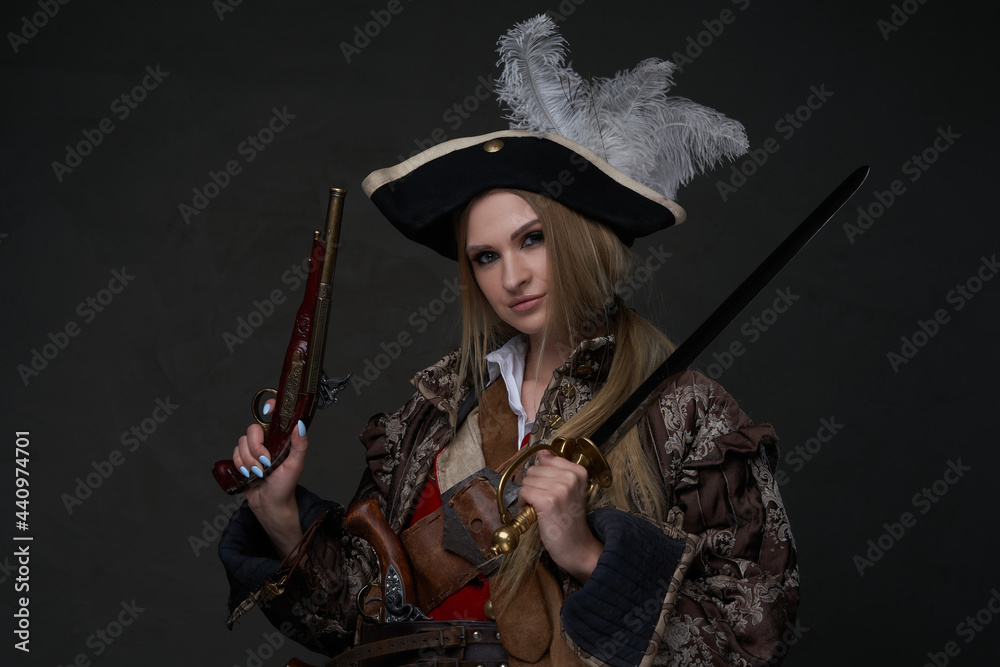 Female model dressed in corsair clothing with gun Stock-Foto | Adobe Stock