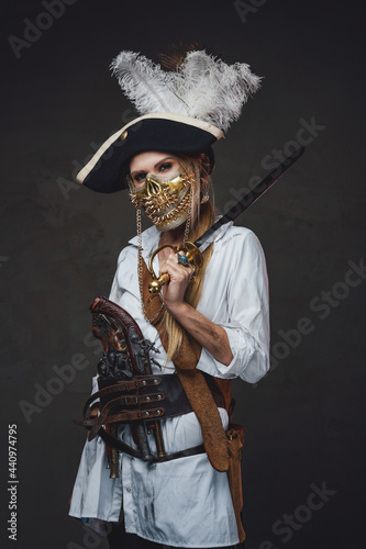 Woman pirate with golden mask and saber