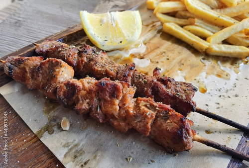 souvlaki potatoes lemon meat roasted traditional in greece photo