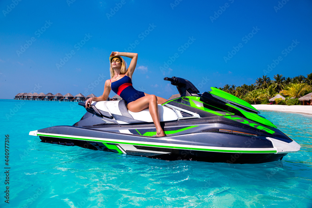 Sexy tanned woman bikini model at Maldives tropical sand beach. Glamour