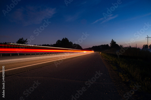 night track with blurred lights from the headlights of cars.long exposure time.