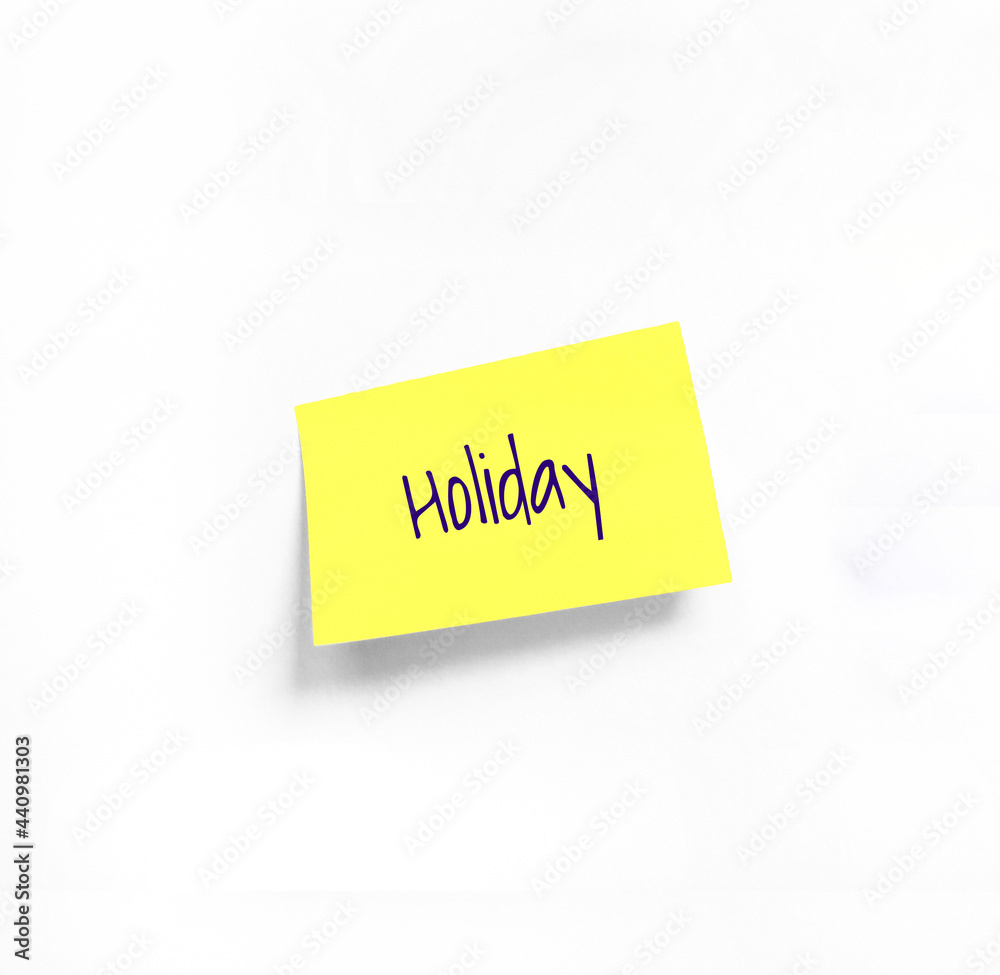 Isolated Yellow sticker with Holiday Handwriting text on white Whatman paper. Concept programming, testing, business. Handwriting text, copy space Isolated Yellow sticker with Holiday Handwriting text on white Whatman paper. Concept programming, testing, business. Handwriting text, copy space