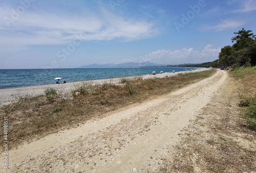 Fototapeta Naklejka Na Ścianę i Meble -  mitikas beach tourist resort sea trees summer in preveza perfecture greece