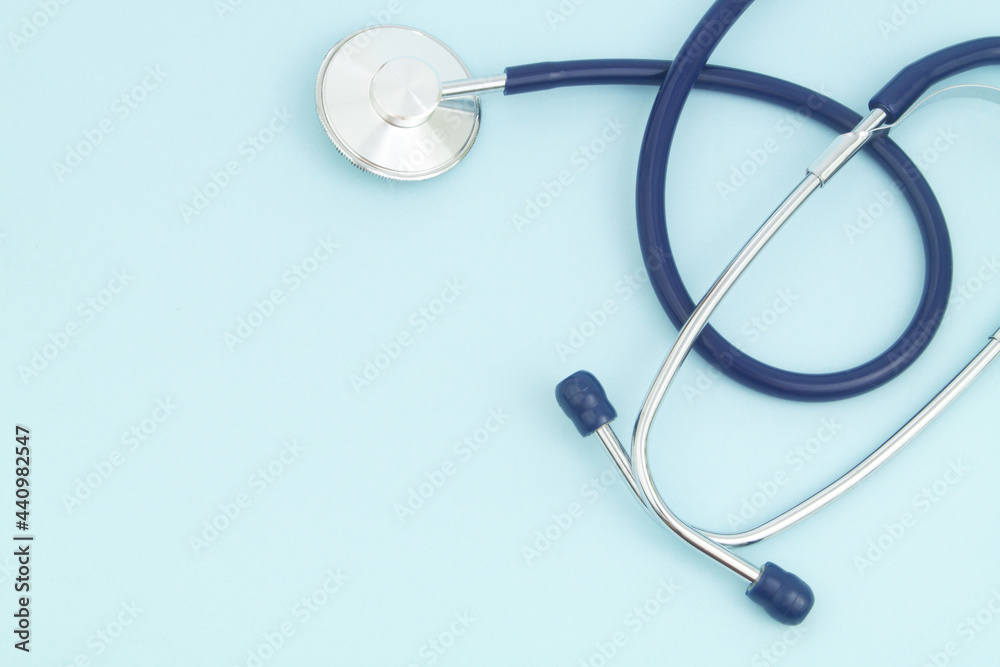 Stethoscope on blue background, copy space for text Stethoscope on blue background, copy space for text