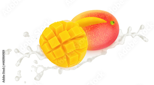 Cutted and whole mango in milk splashes isolated on white background.