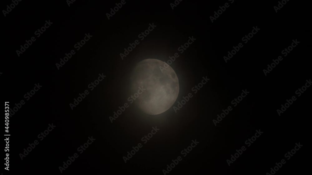The moon in the night with passing clouds The moon in the night with passing clouds
