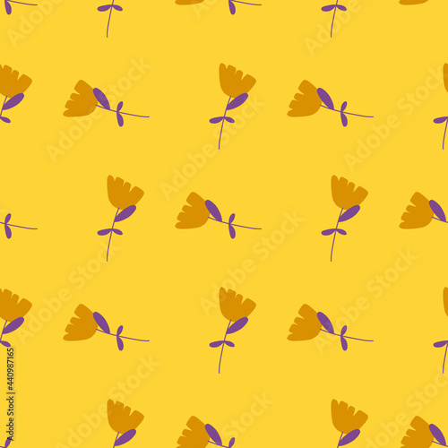 Decorative seamless pattern with random flowers silhouettes. Yellow bright background. Summer print.
