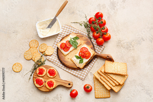 Composition with tasty crackers and ingredients on grunge background