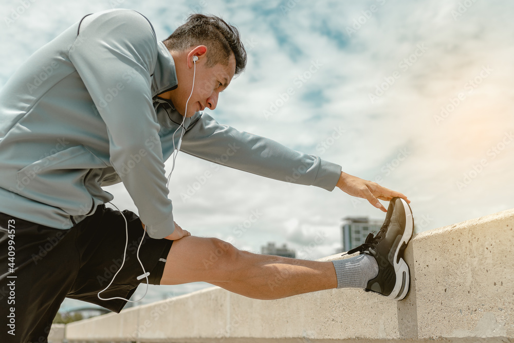 Sport man is stretching leg before exercise. Stretch muscle, preparation exercise concept