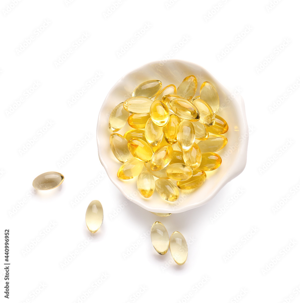 Shell with fish oil capsules on white background Shell with fish oil capsules on white background