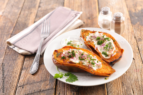 baked sweet potato with cream and herbs