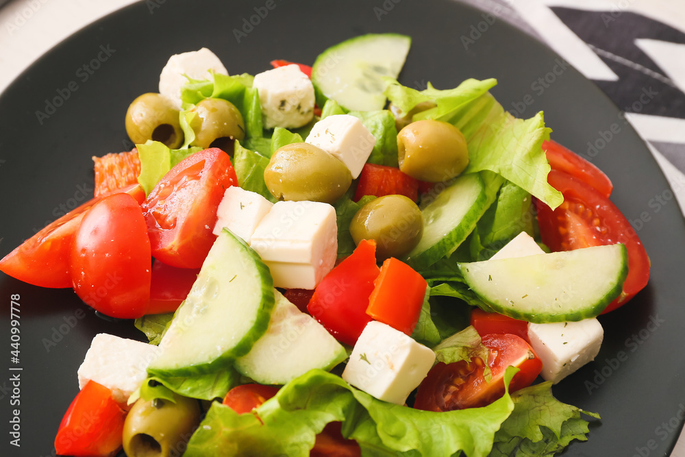 Plate with fresh Greek salad on table, closeup Plate with fresh Greek salad on table, closeup