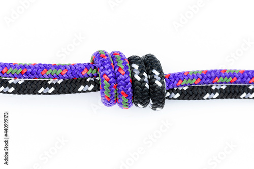 Front side of a fisherman's knot shot on a white background