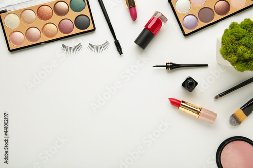 Set of decorative cosmetics on white background with copy space.