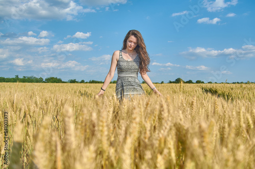 Young girl with long hair in a field © ivana