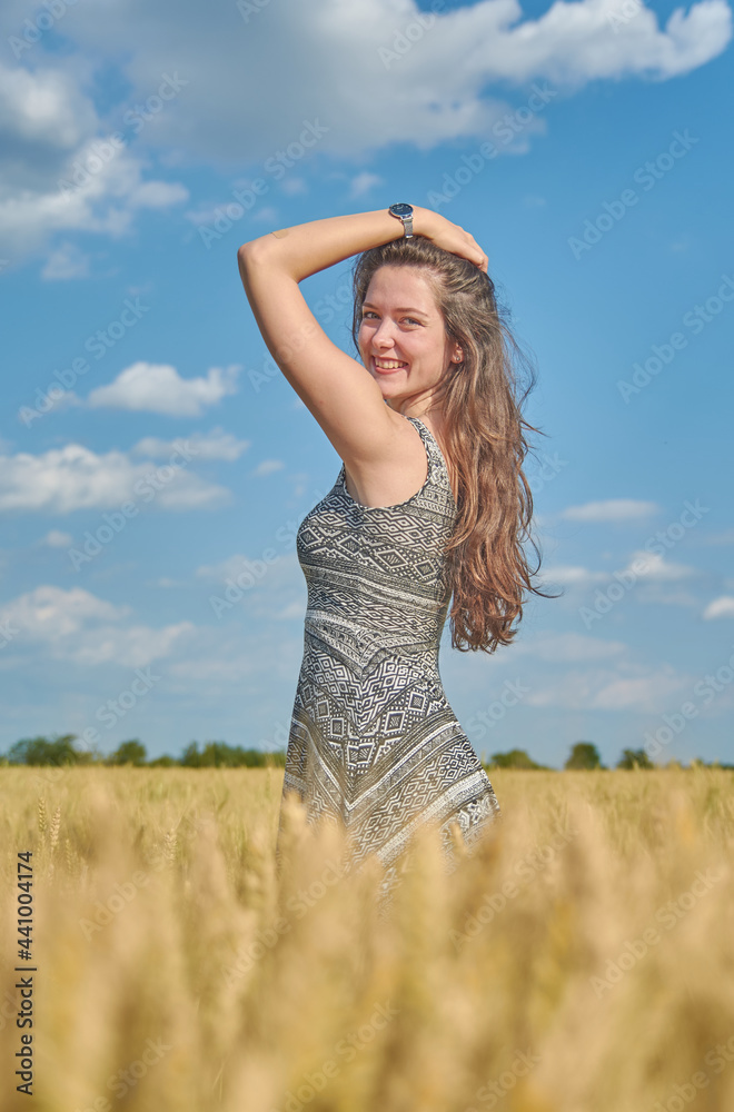 Young girl with long hair in a field Young girl with long hair in a field
